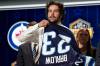 (AP Photo/George Walker IV)
                                Colby Barlow puts on a Winnipeg Jets jersey after being picked by the team 18th during the first round of the NHL Draft Wednesday, in Nashville, Tenn.