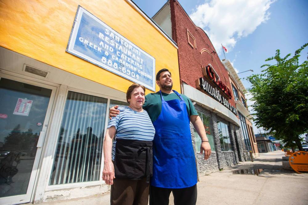 MIKAELA MACKENZIE / WINNIPEG FREE PRESS
Athanasios Karasoulis (right) and Theodora Karasoulis, owners of Santorini Restaurant & Catering on Portage Ave.