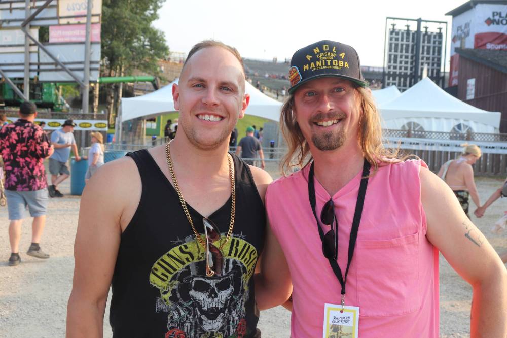 Kyle Darbyson/The Brandon Sun
JR Charron and guitarist Max Dupas, AKA Hamburger Island, at the entrance to the Play Now Stage during the first full day of Dauphin Countryfest 2023. Charron was scheduled to make his official Countryfest debut at the Bell Hilltop Stage later that evening.