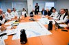 Quebec Premier Francois Legault, right, speaks to officials while forest fires are raging as he visits the crisis operation centre in Quebec City, Wednesday, June 7, 2023. Quebec's wildfire season is the worst on record, officials said Wednesday, as the number of evacuees was expected to rise to more than 15,000 by the end of the day. THE CANADIAN PRESS/Jacques Boissinot