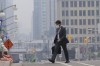 A man walks to work wearing a mask near Parliament Hill, Wednesday, June 7, 2023 in Ottawa. The battle against hundreds of wildfires continued Thursday, as almost every jurisdiction in Canada was under either heat or air quality warnings from the federal government. THE CANADIAN PRESS/Adrian Wyld