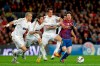 FILE - Barcelona's Lionel Messi from Argentina, right, duels for the ball with Real Madrid's Pepe from Portugal, left, Sergio Ramos and Fabio Coentrao of Portugal, center right, during a Spanish La Liga soccer match at the Camp Nou stadium, in Barcelona on April 21, 2012. Lionel Messi says he is coming to Inter Miami and joining Major League Soccer. After months of speculation, Messi announced his decision Wednesday, June 7, 2023,to join a Miami franchise that has been led by another global soccer icon in David Beckham since its inception but has yet to make any real splashes on the field. (AP Photo/Daniel Ochoa de Olza, File)