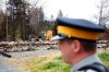 Municipal officials in the Halifax region say they will announce today when evacuation orders will be lifted for certain residents in subdivisions that sustained the most damage when a wildfire broke out on May 28 and eventually destroyed 150 homes. A police officer stands in front of the remains of a home destroyed by a wildfire in Hammond's Plains, N.S., during a media tour, Tuesday, June 6, 2023. THE CANADIAN PRESS/POOL, Tim Krochak