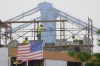 File - Masons work during hazy conditions in Philadelphia, Wednesday, June 7, 2023. The haze from Canada's wildfires is taking its toll on outdoor workers along the Eastern U.S. who carried on with their jobs even as dystopian orange skies forced the cancelation of sports events, school field trips and Broadway plays. (AP Photo/Matt Rourke, File)