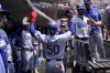 Los Angeles Dodgers' Mookie Betts (50) celebrates with teammates after scoring on a single by David Peralta in the third inning of a baseball game against the Cincinnati Reds in Cincinnati, Thursday, June 8, 2023. (AP Photo/Jeff Dean)