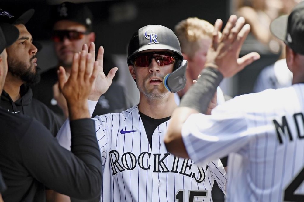 Colorado Rockies' Randal Grichuk celebrates scoring in the first inning of a baseball game against the San Francisco Giants Thursday, June 8, 2023, in Denver. (AP Photo/Geneva Heffernan)