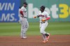 Cleveland Guardians' Jose Ramirez runs past Boston Red Sox third baseman Rafael Devers, left, while running the bases on a home run during the first inning of a baseball game Thursday, June 8, 2023, in Cleveland. (AP Photo/Sue Ogrocki)