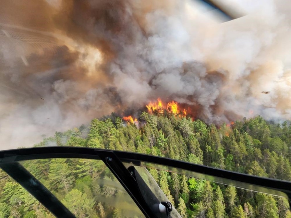 The Sudbury 17 wildfire (SUD017) burns east of Mississagi Provincial Park near Elliot Lake, Ont. in this Sunday, June 4, 2023 handout photo. Air pollution from wildfires remained well above healthy levels across much of southern and northern Ontario and several communities in British Columbia and Alberta. Forecasters expect moderately bad air quality on Friday and Saturday throughout most of Ontario. THE CANADIAN PRESS/HO, Ontario Ministry of Natural Resources and Forestry *MANDATORY CREDIT*