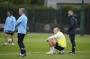Manchester City's Erling Haaland, bottom right, takes a break as he trains with teammates at a UEFA Champions League Media Day before the forthcoming Champion's League final, Manchester, England, Tuesday, June 6, 2023. Manchester City will play Inter Milan in the final of the Champion's League on Saturday June 10 in Istanbul. (AP Photo/Jon Super)