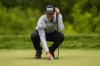 Canadian Corey Conners lines up his ball before putting on the ninth hole during the first round of the Canadian Open in Toronto on Thursday, June 8, 2023. Conners of Listowel, Ont., was tied for first after the first round and is scheduled to tee off in Friday's afternoon wave. THE CANADIAN PRESS/Andrew Lahodynskyj