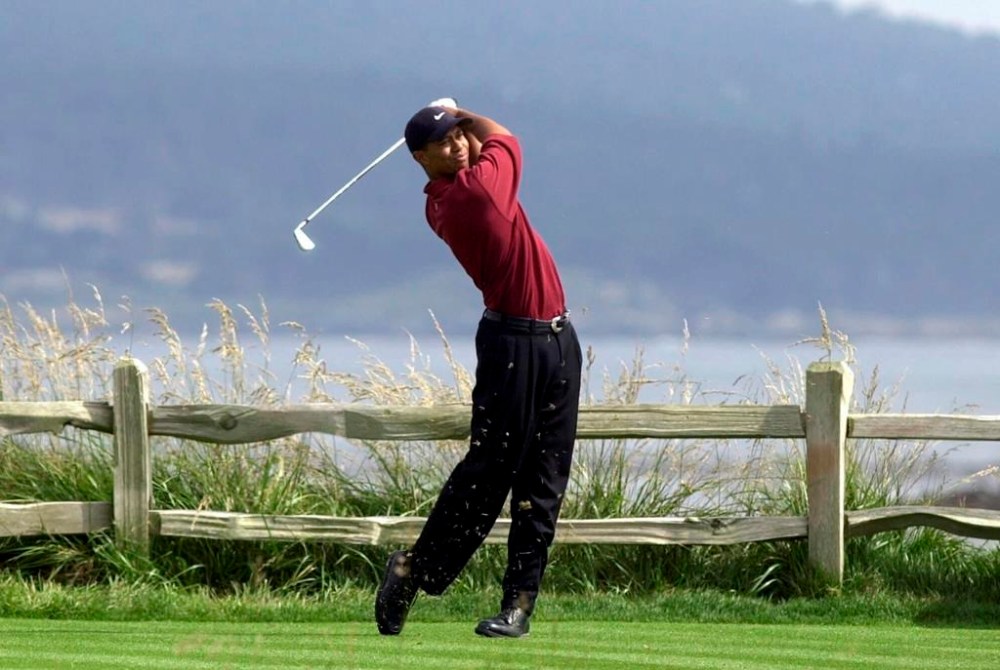 FILE - Tiger Woods drives the 18th hole on his way to winning the 100th U.S. Open Golf Championship at the Pebble Beach Golf Links in Pebble Beach, Calif., Sunday, June 18, 2000. The U.S. Open returns to California for the 15th time. (AP Photo/Elise Amendola, File)