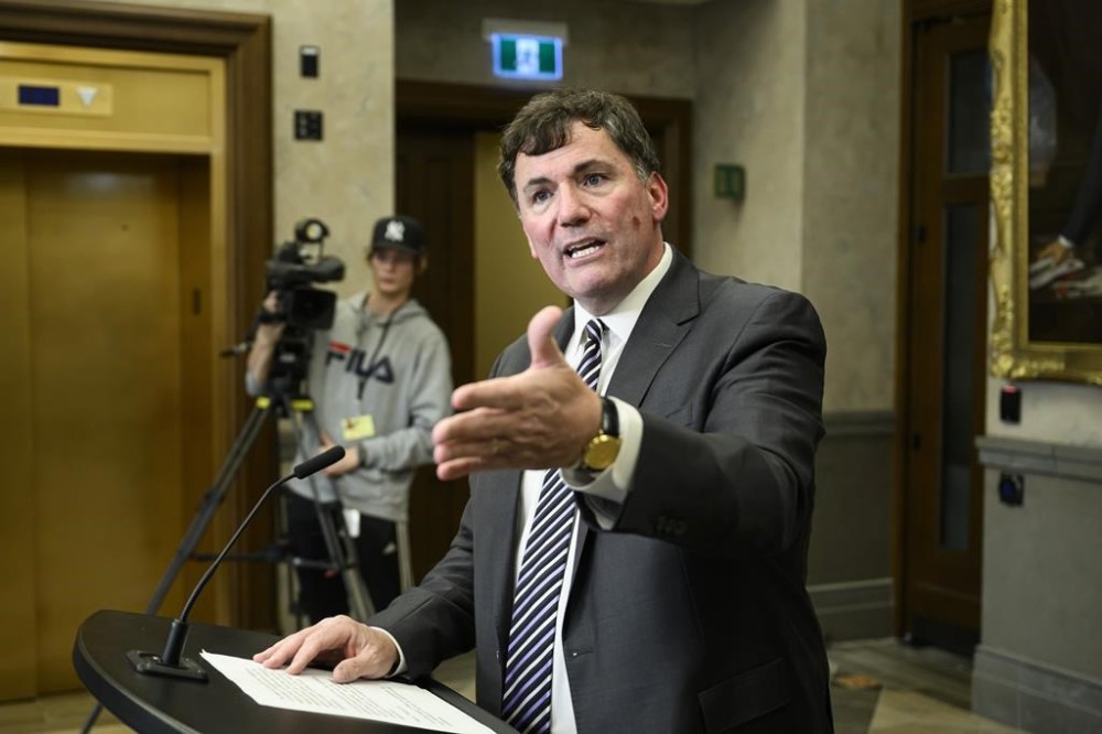 Minister of Intergovernmental Affairs, Infrastructure and Communities Dominic LeBlanc speaks during a news conference following the resignation of David Johnston, Independent Special Rapporteur on Foreign Interference, in the Foyer of the House of Commons on Parliament Hill in Ottawa, on Saturday, June 10, 2023. THE CANADIAN PRESS/Justin Tang