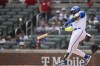 Atlanta Braves designated hitter Marcell Ozuna hits a two-run home in the second inning of a baseball game against the Washington Nationals, Saturday, June 10, 2023, in Atlanta. (AP Photo/Hakim Wright Sr.)