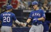 Texas Rangers' Ezequiel Duran (20) congratulates Corey Seager after Seager's two-run home run off Tampa Bay Rays reliever Jalen Beeks during the fourth inning of a baseball game Saturday, June 10, 2023, in St. Petersburg, Fla. (AP Photo/Steve Nesius
