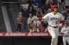 Los Angeles Angels' Shohei Ohtani tosses his bat after hitting a two-run home run during the third inning of a baseball game against the Seattle Mariners Saturday, June 10, 2023, in Anaheim, Calif. (AP Photo/Mark J. Terrill)