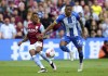 Aston Villa's Leon Bailey, left and Brighton's Pervis Estupinan vie for the ball, during the English Premier League soccer match between Aston Villa and Brighton & Hove, at Villa Park, in Birmingham, England, Sunday May 28, 2023. (Barrington Coombs/PA via AP)
