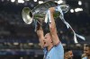 Manchester City's Erling Haaland celebrates with the trophy after winning the Champions League final soccer match between Manchester City and Inter Milan at the Ataturk Olympic Stadium in Istanbul, Turkey, Sunday, June 11, 2023. Manchester City won 1-0. (AP Photo/Francisco Seco)