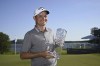 Britain's Dale Whitnell holds the trophy after winning the PGA European Tour, Scandinavian Mixed, at Ullna golf course outside Stockholm, Sweden, Sunday June 11, 2023. (Anders Wiklund/TT via AP)