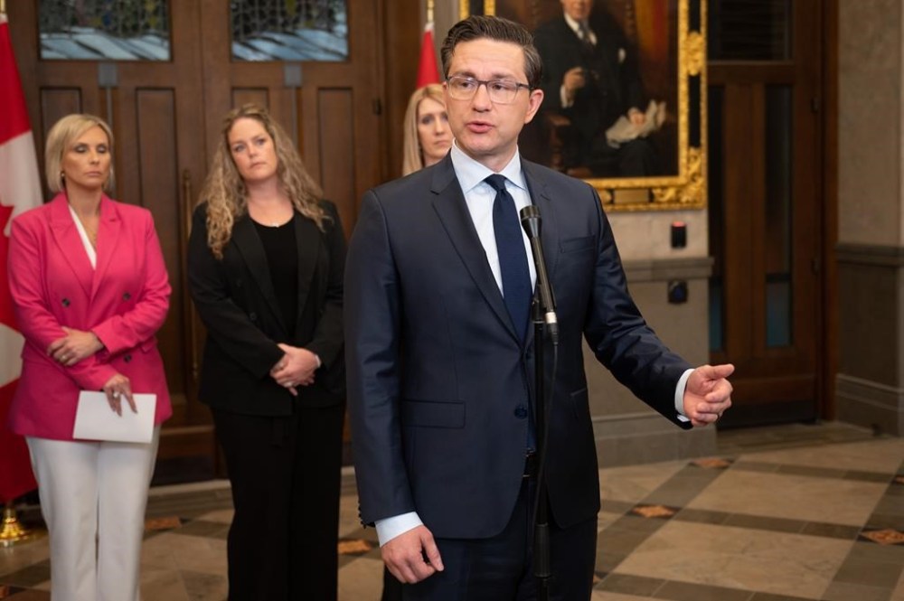 Conservative Party Leader Pierre Poilievre speaks to reporters in the Foyer of the House of Commons on Parliament Hill in Ottawa, on Sunday, June 11, 2023. The Conservative Party is willing to work with other opposition parties to set the terms of reference for a possible inquiry on foreign interference. THE CANADIAN PRESS/Spencer Colby