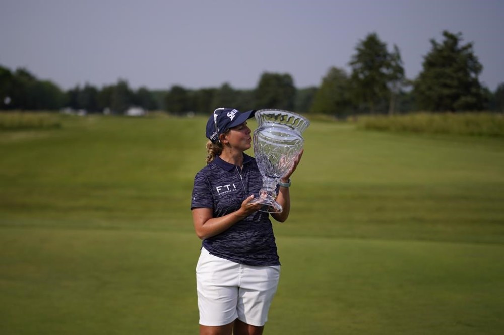 Ashleigh Buhai, of South Africa, poses with the trophy after winning the ShopRite LPGA Classic golf tournament, Sunday, June 11, 2023, in Galloway, N.J. (AP Photo/Matt Slocum)