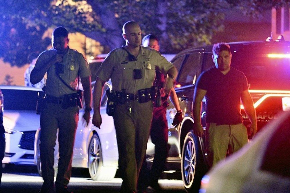 Police respond to the scene where multiple people were shot, some fatally, in the 1000 block of Paddington Place in Annapolis, Md., Sunday, June 11, 2023. (Jerry Jackson/The Baltimore Sun via AP)