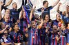 Barcelona's captain Alexia Putellas lifts the trophy after winning the Women's Champions League final soccer match between FC Barcelona and VfL Wolfsburg at the PSV Stadion in Eindhoven, Netherlands, Saturday, June 3, 2023. Barcelona won 3-2. (AP Photo/Martin Meissner)