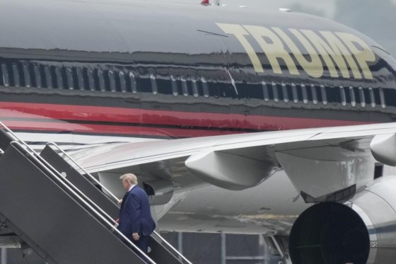 Former U.S. president Donald Trump boards his airplane at Newark Liberty International Airport, Monday in Newark, N.J. (Bryan Woolston / The Associated Press files)