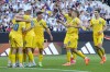 Ukraine players celebrate their side's third goal during a friendly soccer match between Germany and Ukraine in Bremen, Germany, Monday, June 12, 2023. It is the 1000st match for the German national soccer team. (AP Photo/Martin Meissner)