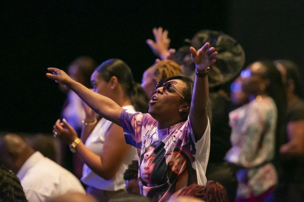 Mourners participate during the funeral for Ajike Owens on Monday, June 12, 2023, at Meadowbrook Church in Ocala, Fla. Owens was fatally shot by her neighbor Susan Lorincz when she went to Lorincz's door. Lorincz was arrested and charged in the shooting. (AP Photo/ Alan Youngblood)