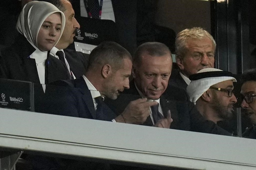 Turkish President Recep Tayyip Erdogan, center, listens to UEFA president Aleksander Ceferin, while attending the Champions League final soccer match between Manchester City and Inter Milan at the Ataturk Olympic Stadium in Istanbul, Turkey, Saturday, June 10, 2023. (AP Photo/Francisco Seco)