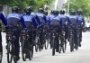 A group of Miami Police officers patrol by bicycle outside the Wilkie D. Ferguson Jr. U.S. Courthouse on Tuesday, June 13, 2023. Former President Donald Trump is making a federal court appearance on dozens of felony charges accusing him of illegally hoarding classified documents and thwarting the Justice Department's efforts to get the records back. (Joe Cavaretta/South Florida Sun-Sentinel via AP)