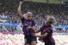 Barcelona's Fridolina Rolfo, left, celebrates after scoring her side's third goal during the Women's Champions League final soccer match between FC Barcelona and VfL Wolfsburg at the PSV Stadion in Eindhoven, Netherlands, Saturday, June 3, 2023. (AP Photo/Martin Meissner)