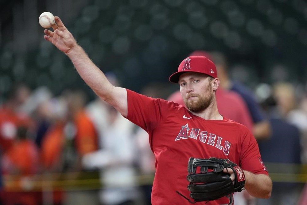 Los Angeles Angels' Brandon Drury throws during batting practice before a baseball game against the Houston Astros Friday, June 2, 2023, in Houston. (AP Photo/David J. Phillip)