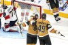 Vegas Golden Knights center Ivan Barbashev, right, celebrates his goal with right wing Jonathan Marchessault, second from right, as Florida Panthers goaltender Sergei Bobrovsky sits in goal during the third period in Game 5 of the NHL hockey Stanley Cup Finals Tuesday, June 13, 2023, in Las Vegas. (AP Photo/Abbie Parr)
