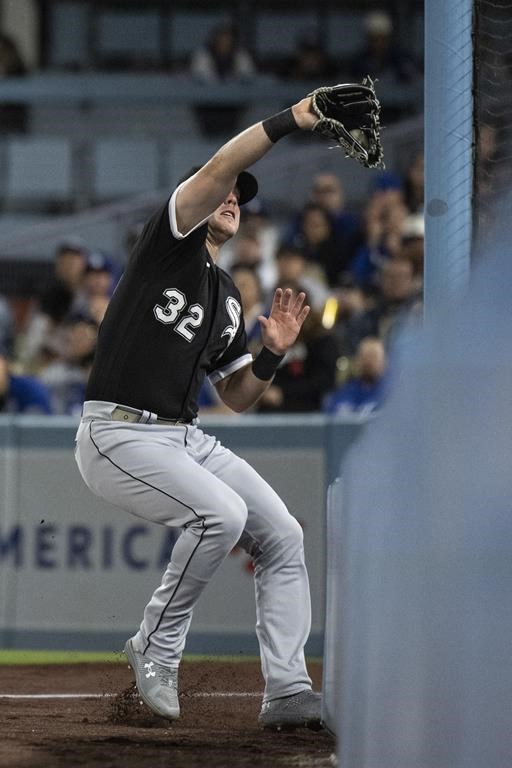 Chicago White Sox right fielder Gavin Sheets catches a fly ball hit by Los Angeles Dodgers' Will Smith during the fifth inning of a baseball game in Los Angeles, Tuesday, June 13, 2023. (AP Photo/Kyusung Gong)