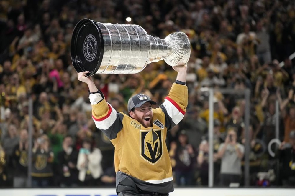 Vegas Golden Knights right wing Jonathan Marchessault skates with the Stanley Cup after the Knights defeated the Florida Panthers 9-3 in Game 5 of the NHL hockey Stanley Cup Finals Tuesday, June 13, 2023, in Las Vegas. The Knights won the series 4-1. (AP Photo/John Locher)