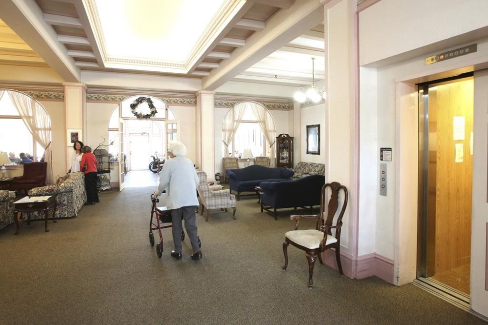 Bret Harte Retirement Inn residents make their way down to the dining room for lunch on May 6, 2020 in Grass Valley, Calif. As many as 8 in 10 older Americans couldn’t afford more than four years in an assisted living facility or two years in a nursing home, according to a recent analysis. This is particularly hard for people in the monetary middle; they don’t have enough to cover the costs of long-term care, but they have too many assets to qualify for government assistance. (Elias Funez/The Union via AP)