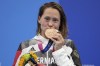 FILE - Sarah Kohler of Germany poses with her bronze medal after the women's 1500-meters freestyle final at the 2020 Summer Olympics, Wednesday, July 28, 2021, in Tokyo, Japan. Olympic swimming bronze medalist Sarah Wellbrock, previously named Sarah Kohler, is retiring from the sport a year before the Paris Games because of longstanding health issues, she said Wednesday, June 14, 2023. (AP Photo/Matthias Schrader, File)