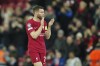 FILE - Liverpool's James Milner applauds fans at the end of the Champions League, round of 16, first leg soccer match between Liverpool and Real Madrid at the Anfield stadium in Liverpool, on Feb. 21, 2023. Milner is joining Brighton on a free transfer after his departure from Liverpool. The versatile 37-year-old midfielder signed a one-year contract Wednesday June 14, 2023 with the option for a further 12 months. (AP Photo/Jon Super, File)