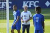 French soccer player Kylian Mbappe, left, and coach Didier Deschamps, center, attend a training session with the French national team at the national soccer team training center in Clairefontaine, west of Paris, Tuesday, June 13, 2023. The door is open for Real Madrid to try signing Kylian Mbappé because the France superstar decided not to extend his Paris Saint-Germain contract into 2025. (AP Photo/Michel Euler)