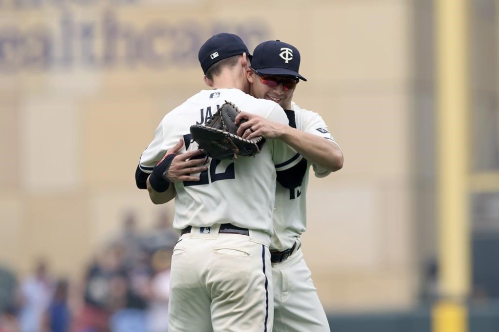 Minnesota Twins' Griffin Jax (22) celebrates with Alex Kirilloff (19) after winning 4-2 against the Milwaukee Brewers following a baseball game Wednesday, June 14, 2023, in Minneapolis. (AP Photo/Stacy Bengs)