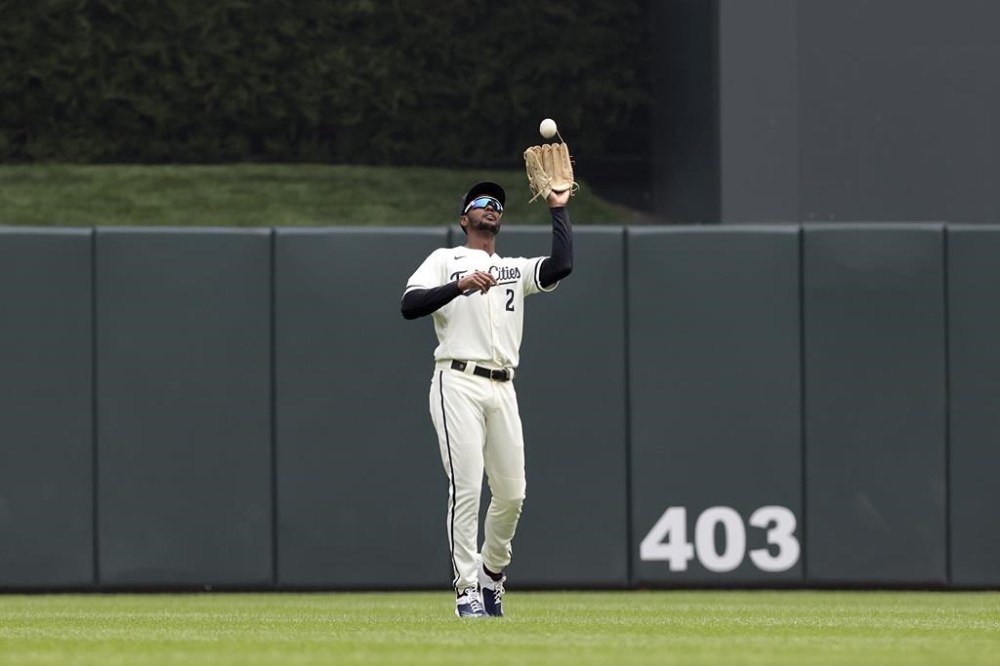 Minnesota Twins center fielder Michael A. Taylor catches a fly ball hit by Milwaukee Brewers' Owen Miller during the first inning of a baseball game Wednesday, June 14, 2023, in Minneapolis. (AP Photo/Stacy Bengs)