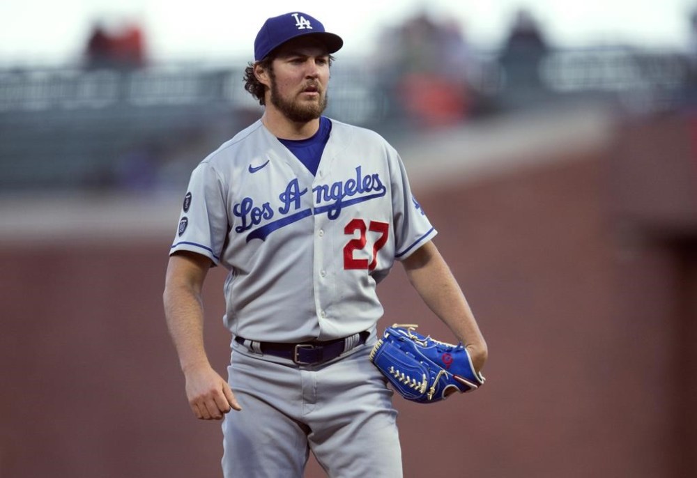 FILE - Los Angeles Dodgers starting pitcher Trevor Bauer looks toward home during the team's baseball game against the San Francisco Giants on May 21, 2021, in San Francisco. An Arizona woman has accused former pitcher Bauer of sexual assault, alleging in a lawsuit updated this week that he held a knife at her throat and choked her until she passed out during a rape that left her pregnant in late 2020. Bauer was never arrested or charged and he has countersued, denying the allegations and accusing the woman of faking a pregnancy and trying to extort money from him. (AP Photo/D. Ross Cameron, File)