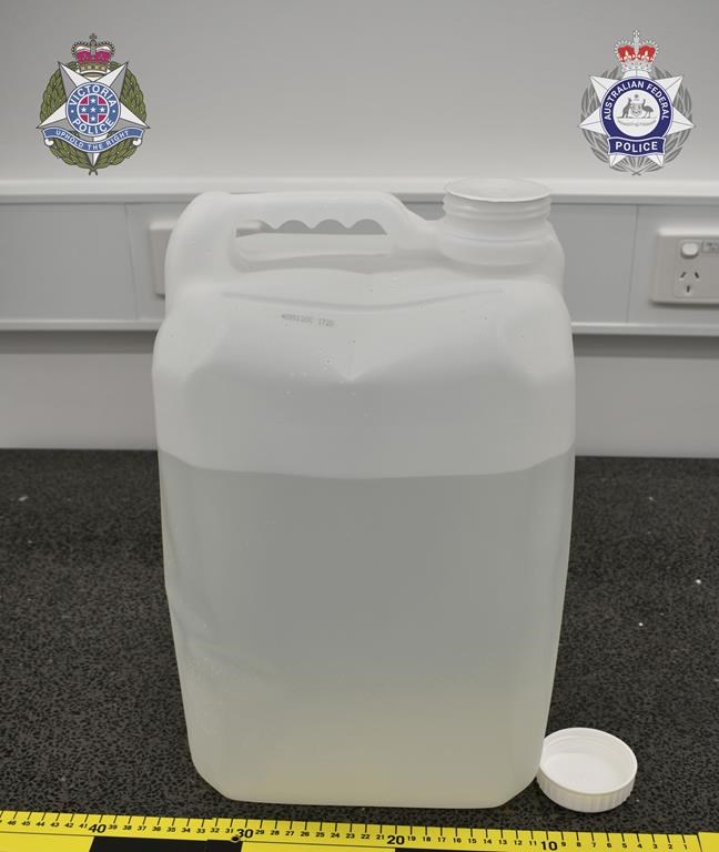 In this undated photo provided by the Australian Federal Police a jug alleged to contain methamphetamine is displayed in Melbourne. A drug syndicate that tried to smuggle tons of methamphetamine from Canada to Australia and New Zealand by hiding it in shipments of maple syrup and canola oil has been busted, authorities said Thursday, June 15. (Australian Federal Police via AP)