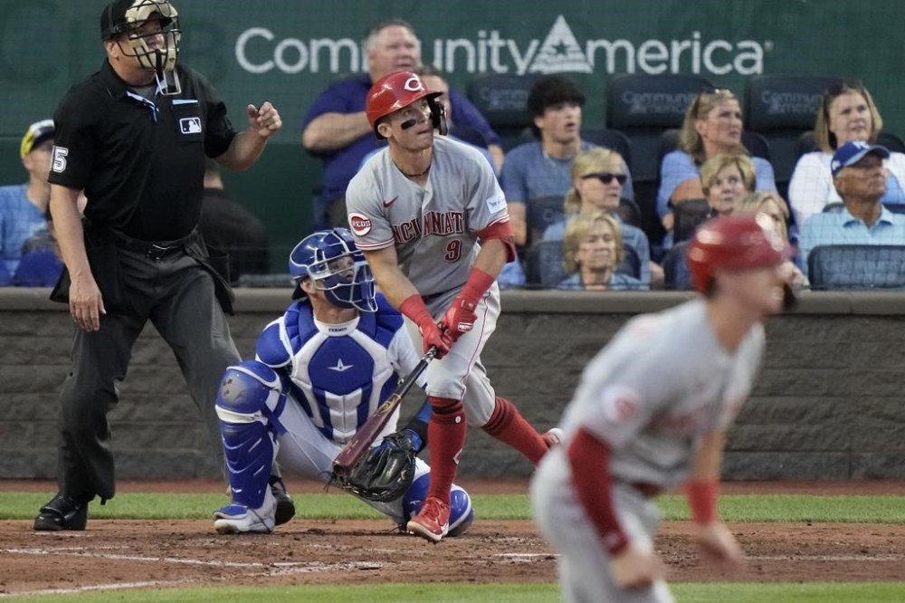 Cincinnati Reds' Matt McLain (9) watches his three-run home run during the fifth inning of a baseball game against the Kansas City Royals Wednesday, June 14, 2023, in Kansas City, Mo. (AP Photo/Charlie Riedel)