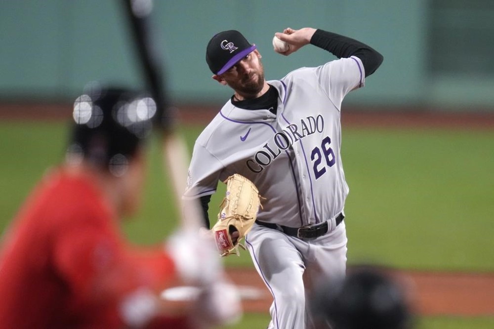 Colorado Rockies starting pitcher Austin Gomber delivers to a Boston Red Sox batter during the first inning of a baseball game at Fenway Park, Wednesday, June 14, 2023, in Boston. (AP Photo/Charles Krupa)