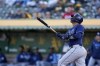 Tampa Bay Rays' Christian Bethancourt watches his sacrifice fly against the Oakland Athletics during the second inning of a baseball game in Oakland, Calif., Wednesday, June 14, 2023. Randy Arozarena scored. (AP Photo/Godofredo A. Vásquez)