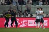 Security officers pursue a fan as he hugs Argentina's Lionel Messi during play on the field in their friendly soccer match at Workers' Stadium in Beijing, Thursday, June 15, 2023. (AP Photo/Mark Schiefelbein)