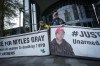 Protesters hold banners with a photograph of Myles Gray, before the start of a coroner's inquest into his death, in Burnaby, B.C., on Monday, April 17, 2023. Gray died following a confrontation with several police officers in 2015. THE CANADIAN PRESS/Darryl Dyck