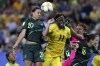 FILE - Australia's Sam Kerr, top left, jumps for the ball with Jamaica's Khadija Shaw, center, during the Women's World Cup Group C soccer match at Stade des Alpes stadium in Grenoble, France, June 18, 2019. Players from the Jamaican women’s national team took to social media on Thursday, June 15, 2023, to decry their federation’s support of the team and its preparation heading into the Women’s World Cup next month. (AP Photo/Laurent Cipriani, File)